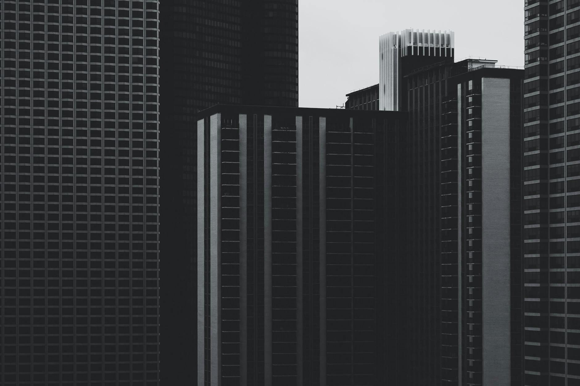 grayscale photo of high rise buildings